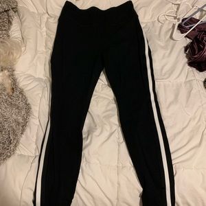 Black leggings with white strip down side